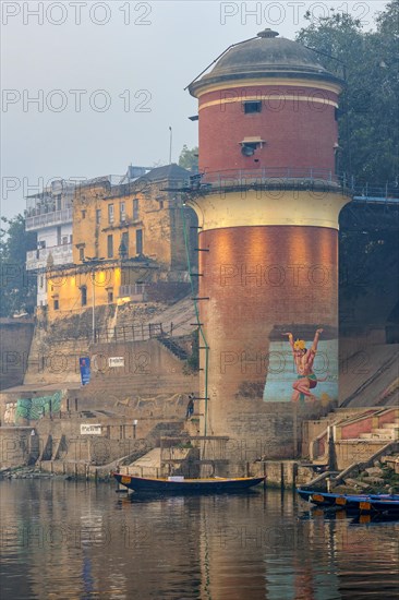 Red water tower on the Ganges riverbank