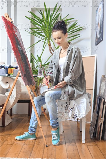 Portrait of a female painter at work