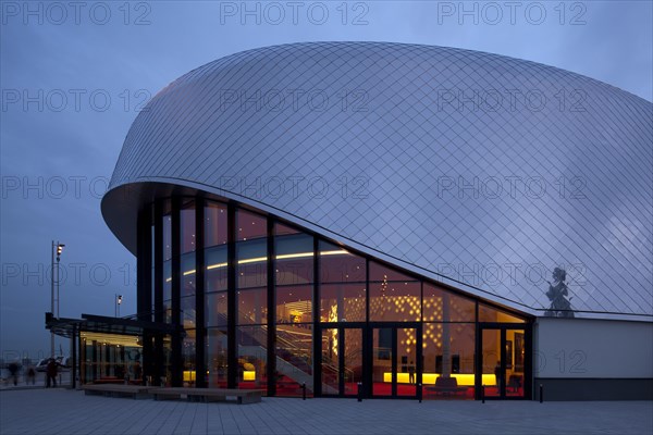 Stage Theater an der Elbe at dusk with illuminated hall