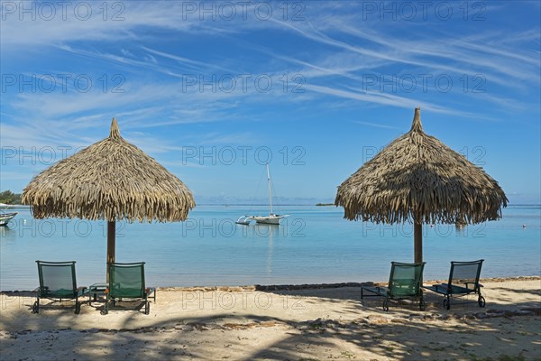 Parasols and sun loungers on the beach