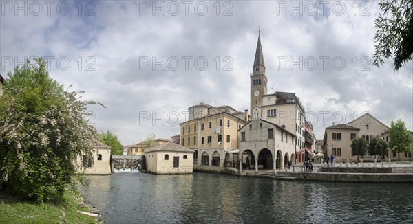 The leaning tower of the cathedral and the old mill