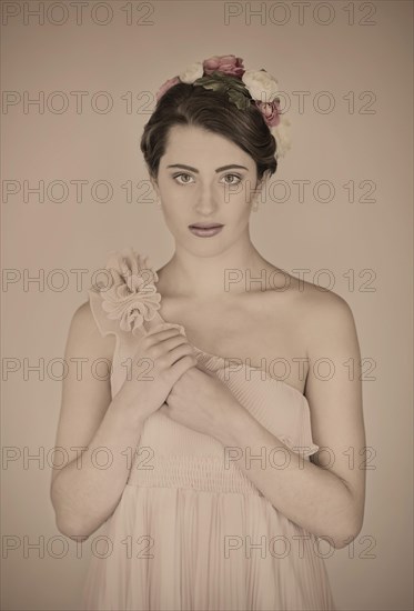 Beauty portrait of a young woman with flowers in her hair