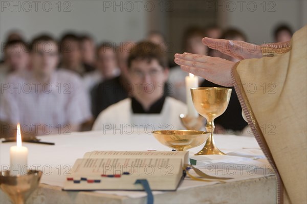 Priest blessing the holy sacrament