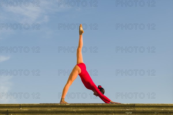 Young woman practising Hatha yoga