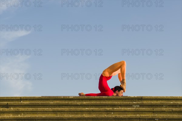 Young woman practising Hatha yoga