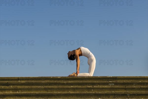 Young woman practising Hatha yoga