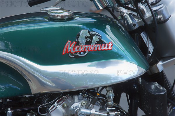 The logo on the motorcycle tank of the Munch 4 Mammut TTS-E