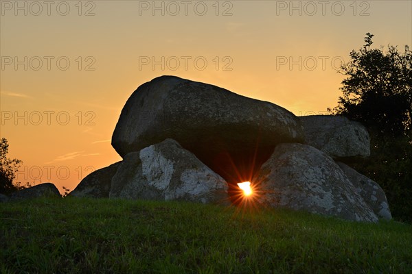 Sunbeam shining through the Sprove Dolmen at sunset