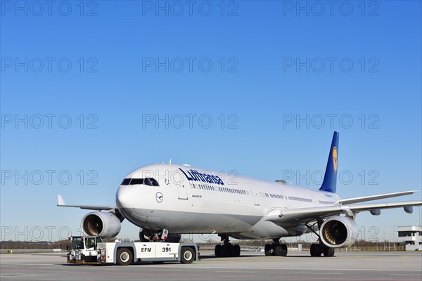 Lufthansa Airbus A340-600 with pushback truck