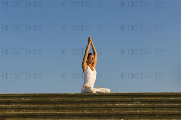 Young woman practising Hatha yoga