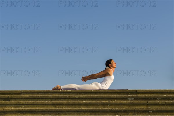 Young woman practising Hatha yoga