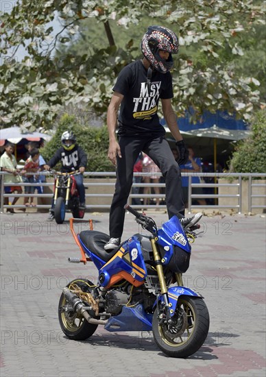 Motorcycle stunt rider performing