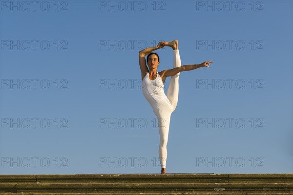 Young woman practising Hatha yoga