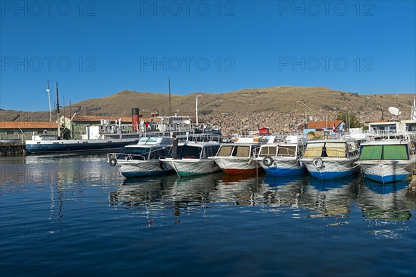 Boats in the harbour of Puno on Lake Titicaca
