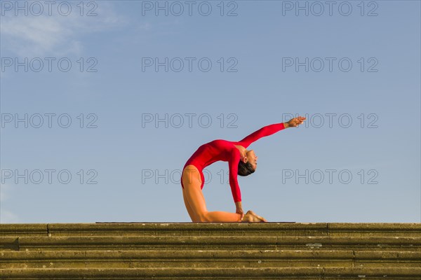 Young woman practising Hatha yoga