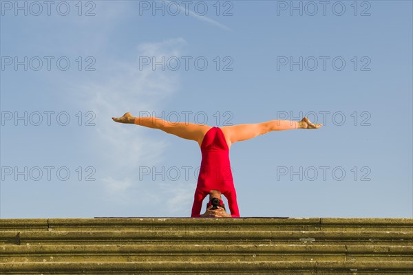 Young woman practising Hatha yoga