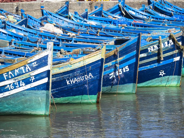Old blue fishing boats in the port of Essaouira