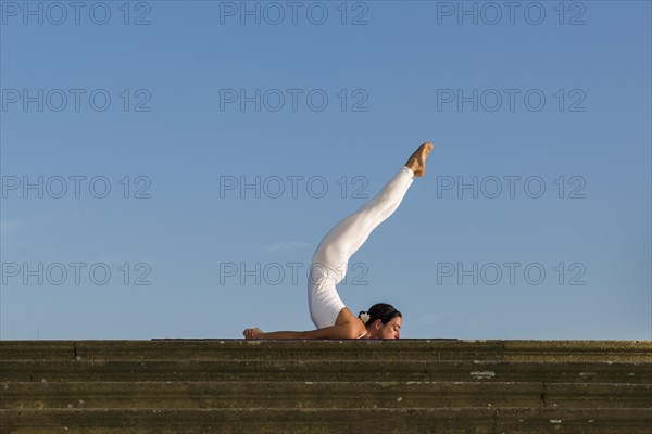 Young woman practising Hatha yoga