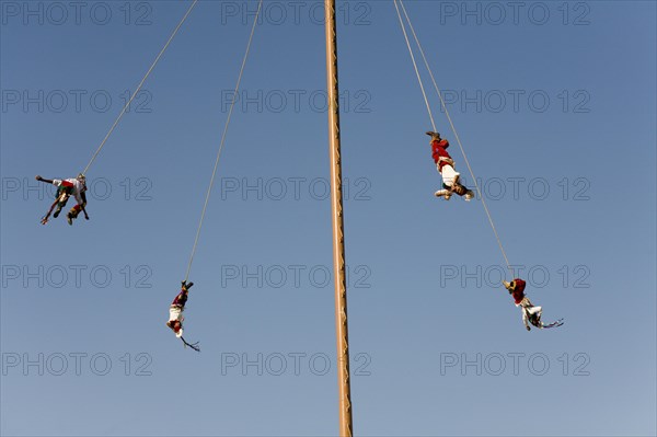 Voladores performing at a village festival