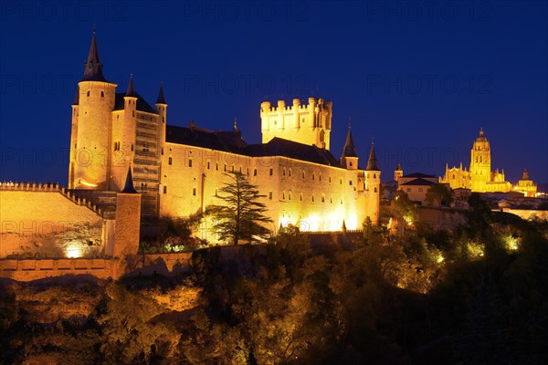 Alcazar fortress and cathedral at dusk