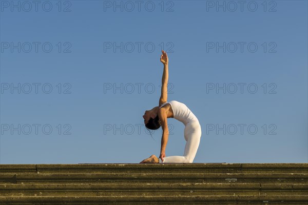 Young woman practising Hatha yoga