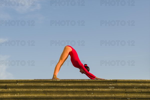 Young woman practising Hatha yoga
