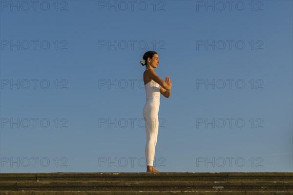 Young woman practising Hatha yoga