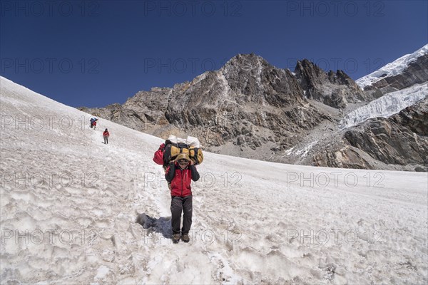 Carrier descending from the Cho La pass over snow field