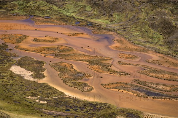 Small meandering river carries large quantities of sediments