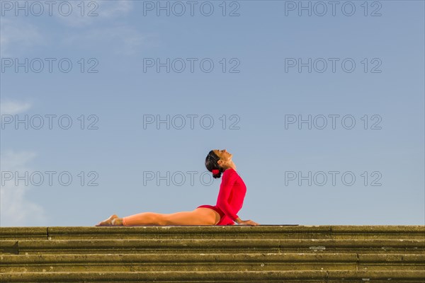Young woman practising Hatha yoga
