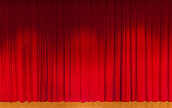 A curtain in dark red
