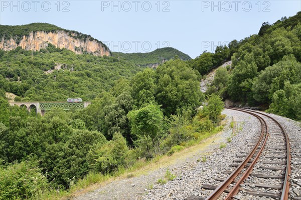 Trenino Verde narrow gauge railway from Arbatax to Manda on a bridge near Niala