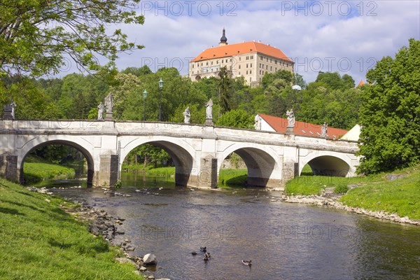 Baroque bridge with statues of Joseph Winterhalder and Namest nad Oslavou Chateau