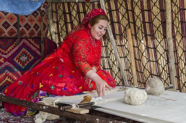 Qashqai woman weaving a carpet