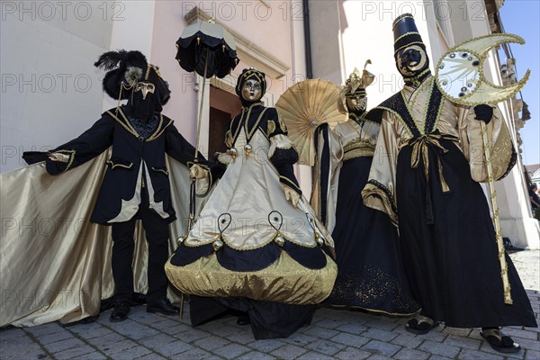 Venetian Carnival masks and costumes at the Venetian Fair on the historic market square