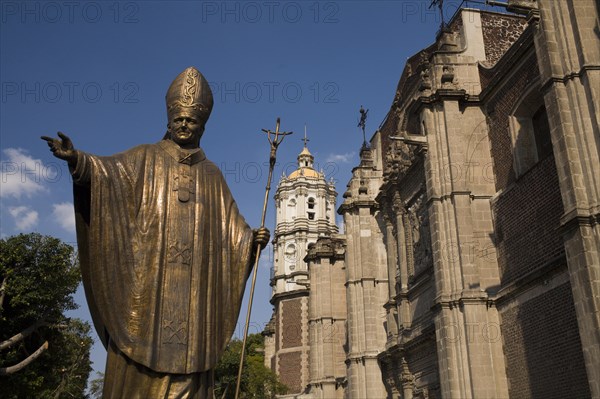 Statue of John Paul II next to the old Basilica of Our Lady of Guadalupe