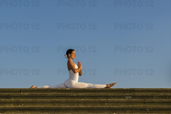 Young woman practising Hatha yoga
