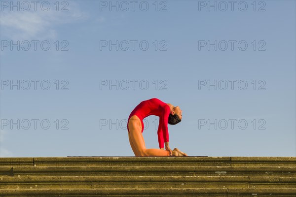 Young woman practising Hatha yoga