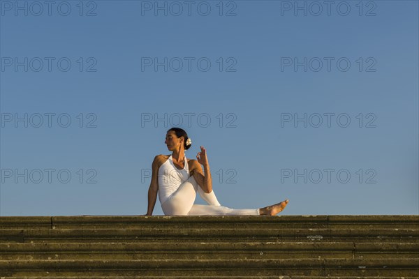 Young woman practising Hatha yoga