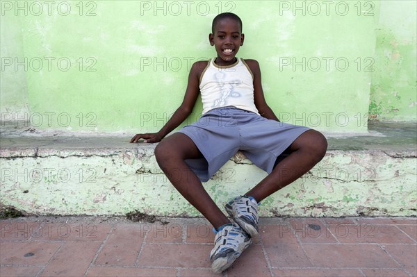 Cuban boy in Plaza San Juan de Dios