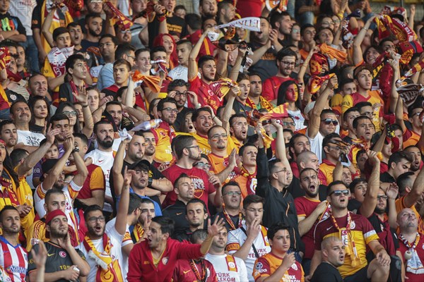 Fans of Galatasaray Istanbul cheer on their team during a friendly game against SK Rapid Vienna