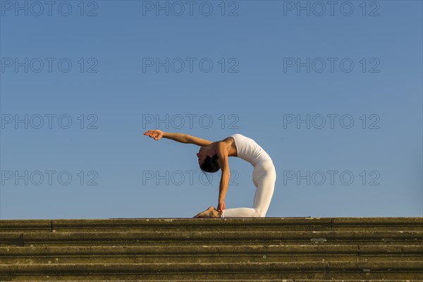 Young woman practising Hatha yoga
