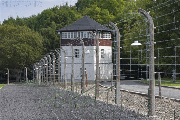 Reconstructed camp fence with watchtower