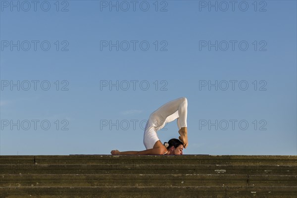 Young woman practising Hatha yoga