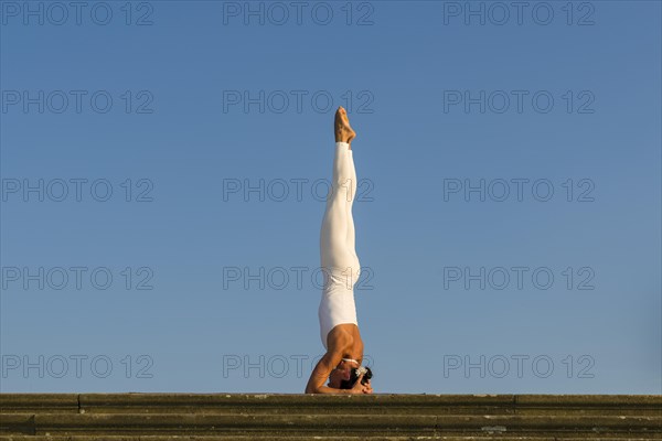 Young woman practising Hatha yoga