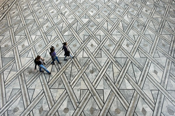 Visitors crossing the Central Hall of the Oslo City Hall