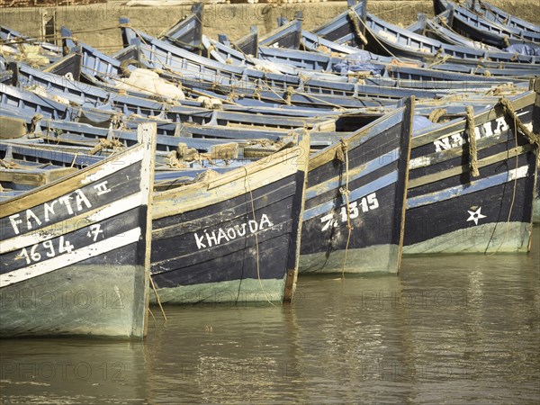 Old blue fishing boats in the port of Essaouira