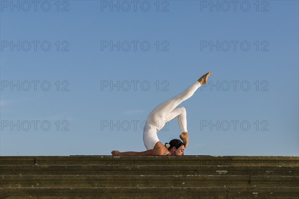 Young woman practising Hatha yoga