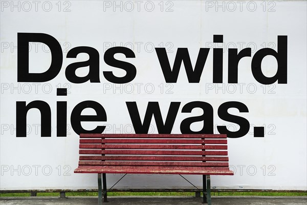 Bus stop that says ""Das wird nie was"" or ""that'll never work""