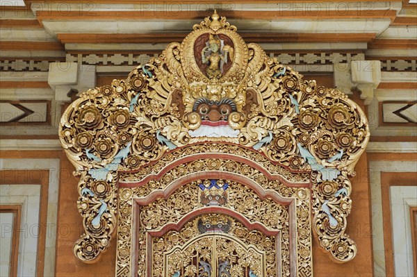 Wooden door decorated with carvings